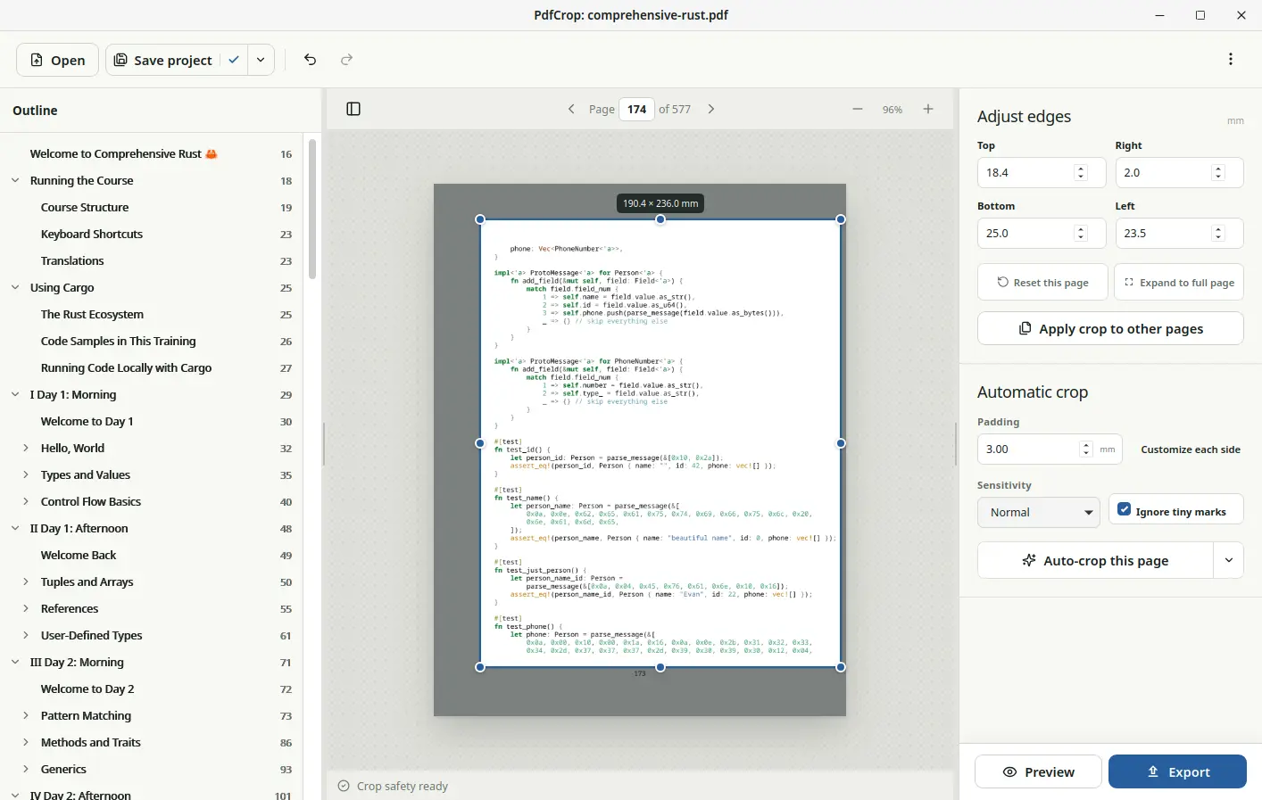 PdfCrop showing a document outline, an adjustable crop around a programming book page, and manual and automatic crop controls.